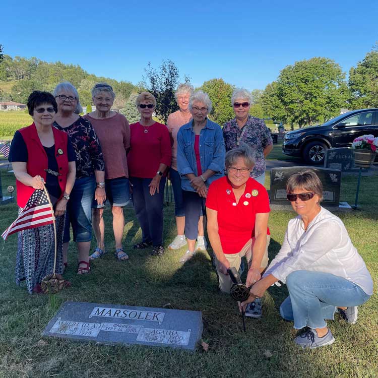 Unit 186 members with grave markers 