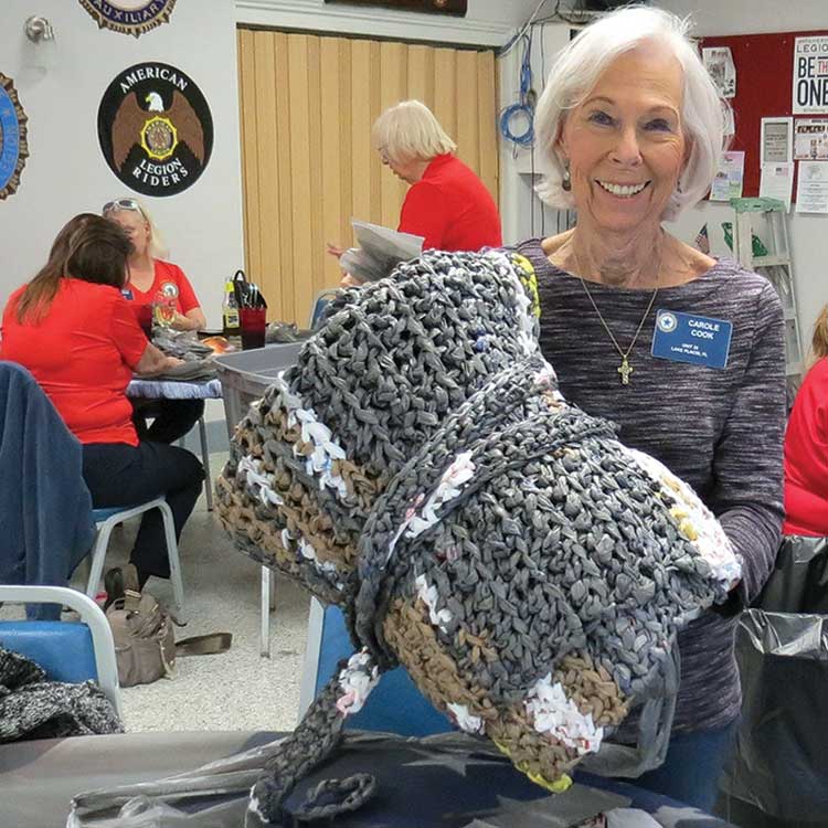 member with crochet blanket