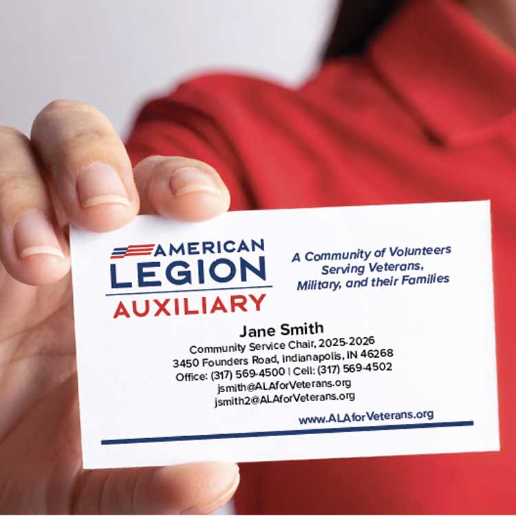 woman holding up ALA business card 