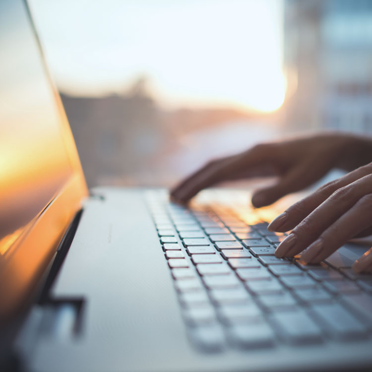 person typing on computer